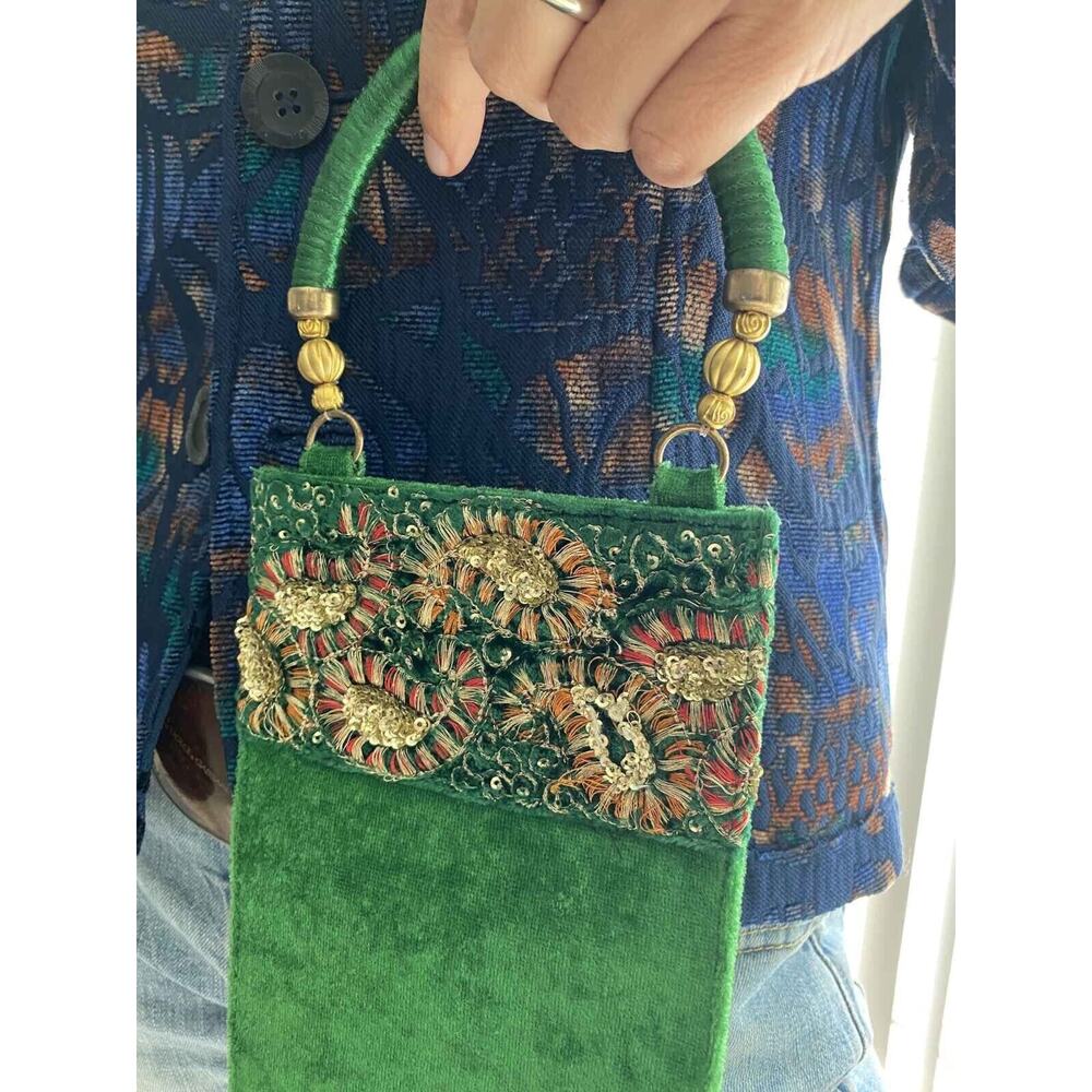 Women's elegant handbag made of velvet. Emerald color